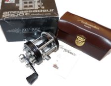 REEL: Abu Ambassadeur 6000c Anniversary 1921-1991 multiplier reel, new and unused, black grooved end