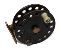 REEL: An ebonite/brass Facile reel, 4" perforated drum, counterbalanced crazed white handle,