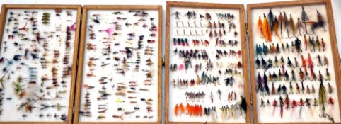 FLIES: Collection of trout and salmon flies in two wood reservoir boxes 12" x8"; about everything