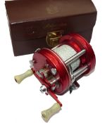 REEL: Abu Ambassadeur 5000 red multiplier reel, 4 screw grooved end plates, twin white handles, foot