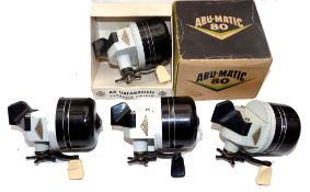 REELS: (4) Collection of 4 Abu-Matic 80 spinning reels, black grey finish, three with cream handles,