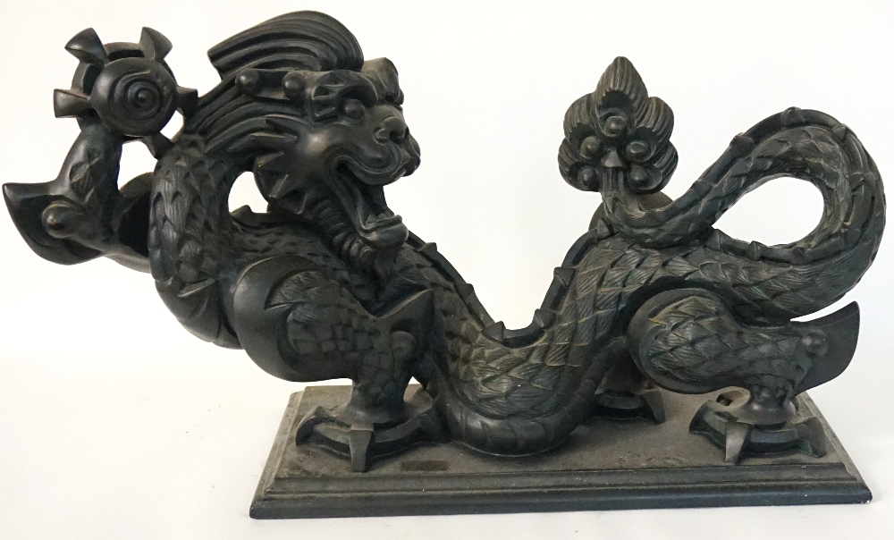 METAL SCULPTURE OF THE HAPPY DRAGON 
by Austin Sculpture Collection, mounted on an oblong plinth,