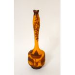 LOETZ CAMEO VASE
the long slim necked vase with orange body overlaid with floral etched rust