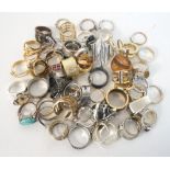 COLLECTION OF SILVER AND OTHER RINGS of various sizes and designs,