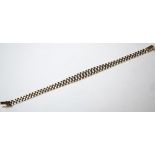 NINE CARAT TWO TONE GOLD BRACELET the chain links widening at the centre,