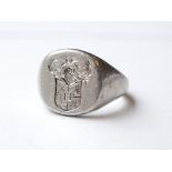 GENTLEMAN'S PLATINUM SEAL RING with family crest, ring size P-Q, approximately 21.