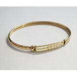 NINE CARAT GOLD MACKINTOSH DESIGN BANGLE approximately 5.