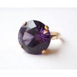 ALEXANDRITE SINGLE STONE RING on unmarked gold shank,