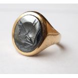 HEMATITE INTAGLIO SIGNET RING decorated with centurion's head, in nine carat gold,