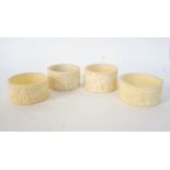 FOUR IVORY NAPKIN RINGS