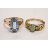 DIAMOND AND JADE DRESS RING the central cabochon jade stone flanked by a diamond to each side,