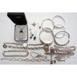 SELECTION OF SILVER JEWELLERY including bangles of various designs,