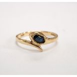 NINE CARAT GOLD SNAKE RING with inset sapphire to head,