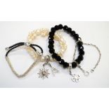 THREE 'THOMAS SABO' CHARM CLUB BRACELETS one in black obsidian, another in pearl,