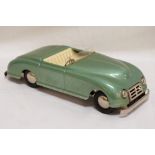 HAROLD FLORY SELF-STEERING ELECTRIC CAR with a removable green tin plate body, battery operated,