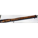 BAMBOO FISHING ROD in two sections with a cork grip handle, for either boat or pier fishing,