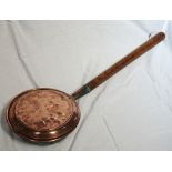 CIRCULAR COPPER WARMING PAN with a lift up lid and a turned hickory handle,