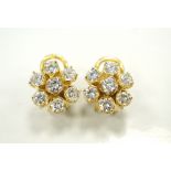 IMPRESSIVE PAIR OF DIAMOND CLUSTER EARRINGS each flower head design earring set with seven round