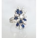 IMPRESSIVE DIAMOND AND SAPPHIRE CLUSTER COCKTAIL RING set with multi round cut diamonds and