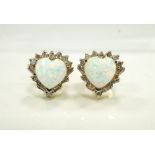 PAIR OF OPAL AND DIAMOND CLUSTER STUD EARRINGS the central heart shaped opal on each in round and