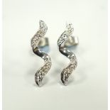 PAIR OF DIAMOND SET SPIRAL DESIGN EARRINGS in nine carat white gold