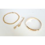 SELECTION OF NINE CARAT GOLD JEWELLERY comprising a christening bangle, a fancy link bracelet,