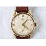 1950's GENTLEMAN'S 'OMEGA' NINE CARAT GOLD CASED WRISTWATCH with Arabic numerals and subsidiary