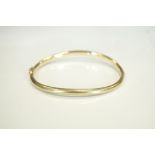 NINE CARAT GOLD HINGED BANGLE approximately 7.