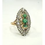 DIAMOND AND EMERALD CLUSTER RING the gem stones in marquise shaped setting, on unmarked gold shank,