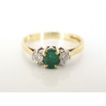 EMERALD AND DIAMOND THREE STONE RING on eighteen carat gold shank,