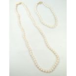 CULTURED PEARL NECKLACE AND MATCHING BRACELET both with nine carat gold clasps,