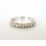 DIAMOND HALF ETERNITY RING the diamonds totalling approximately 0.