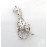 DIAMOND SET GIRAFFE BROOCH the multi white diamond set body with black diamond spots and ruby eye,