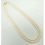 DOUBLE STRAND CULTURED PEARL NECKLACE with nine carat gold clasp,