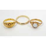 TEN CARAT GOLD WEDDING BAND together with two unmarked gold rings, one set with cabochon stone,