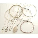 SELECTION OF SILVER JEWELLERY comprising four silver bangles, a pink stone set line bracelet,