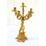 ORNATE GILT BRASS FIVE BRANCH CANDELABRA of multi-piece construction, with floral scrollwork design,