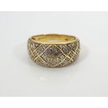 MULTI DIAMOND SET DRESS RING in eighteen carat gold, the diamonds in attractive geometric setting,