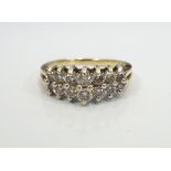 DIAMOND CLUSTER RING on fourteen carat gold shank,