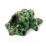 WILLIAM BARON ARTS AND CRAFT POTTERY FROG with a green and blue spot decorated body with yellow