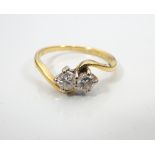 DIAMOND TWO STONE RING on eighteen carat gold shank with twist setting,