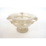 ROMAN GLASS THREE HANDLED BOWL with flared rim and shaped body, raised on circular base, 10.
