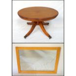 MAHOGANY AND CROSSBANDED OVAL OCCASIONAL TABLE with a tilt top action,