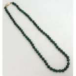 MALACHITE BEAD NECKLACE with nine carat gold clasp and individually knotted string,