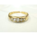 GRADUATED DIAMOND FIVE STONE RING on gold shank, the diamonds totalling approximately 0.
