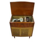 1950's 'BUSH' MAHOGANY CASED RADIOGRAM 'Type SRG100', the lift-up lid opening to reveal turntable,