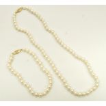 CULTURED PEARL NECKLACE AND MATCHING BRACELET both with nine carat clasps,