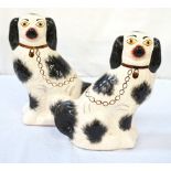 PAIR OF 20th CENTURY STAFFORDSHIRE POTTERY WALLY DOGS with black and gilt detailing, 29.