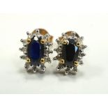 PAIR OF SAPPHIRE AND DIAMOND CLUSTER STUD EARRINGS in nine carat gold