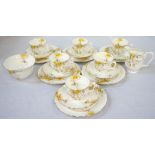 CROWN STAFFORDSHIRE CHINA TEA SERVICE with floral decoration on white ground, comprising six cups,